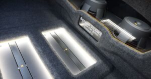 The inside of a trunk with a car audio build