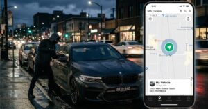 A man breaking into a parked car on a city street and a phone with a Dronemobile system showing on it